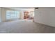 Living room with large window and dining room view at 4805 W Saguaro Park Ln, Glendale, AZ 85310