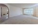 Living room with view of bathroom and window at 4805 W Saguaro Park Ln, Glendale, AZ 85310