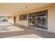 Covered patio with sliding glass doors and concrete flooring at 4805 W Saguaro Park Ln, Glendale, AZ 85310