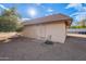 Tan colored storage shed with gravel surroundings at 4805 W Saguaro Park Ln, Glendale, AZ 85310