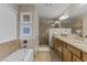 Elegant bathroom with dual vanities, a soaking tub, and a walk-in shower at 5134 N 33Rd St, Phoenix, AZ 85018