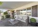 Relaxing front porch with wicker furniture and decorative plants at 5134 N 33Rd St, Phoenix, AZ 85018