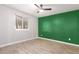 Bedroom with green accent wall and ceiling fan at 5732 W Purdue Ave, Glendale, AZ 85302