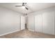 Bedroom with sliding door closet and ceiling fan at 5732 W Purdue Ave, Glendale, AZ 85302