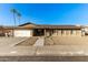 Single-story home with solar panels and a spacious front yard at 5732 W Purdue Ave, Glendale, AZ 85302