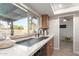 Kitchen with sink, modern faucet, and backyard view at 5732 W Purdue Ave, Glendale, AZ 85302