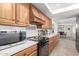 Bright kitchen featuring wood cabinets and updated appliances at 5732 W Purdue Ave, Glendale, AZ 85302