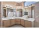 Corner double vanity bathroom with large mirror and access to shower at 6429 E Everett Dr, Scottsdale, AZ 85254