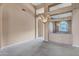 Elegant dining room with high ceilings, chandelier, and mirrored wall at 6429 E Everett Dr, Scottsdale, AZ 85254