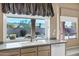 Kitchen features double sink, dishwasher, and backyard view at 6429 E Everett Dr, Scottsdale, AZ 85254