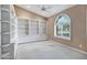 Built-in shelving and arched window in a home library at 6429 E Everett Dr, Scottsdale, AZ 85254