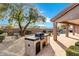 Built-in outdoor kitchen with grill and prep area at 6429 E Everett Dr, Scottsdale, AZ 85254