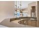 Home wet bar with mirrored backsplash and sink at 6429 E Everett Dr, Scottsdale, AZ 85254