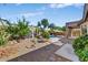 Landscaped backyard with a pool, shed, and stone pathway at 6502 E Blanche Dr, Scottsdale, AZ 85254