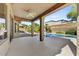 Covered patio overlooks a refreshing pool and spacious backyard at 6502 E Blanche Dr, Scottsdale, AZ 85254