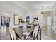 Open concept dining room with a view into the living room and kitchen at 6502 E Blanche Dr, Scottsdale, AZ 85254