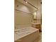 Full bathroom featuring a soaking tub and a wood vanity with ample counter space at 701 W Cambridge Ave, Phoenix, AZ 85007