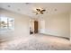 Spacious bedroom with natural light, ceiling fan and neutral carpet at 701 W Cambridge Ave, Phoenix, AZ 85007