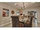 Elegant dining room with a glass table, decorative chairs, and modern lighting at 701 W Cambridge Ave, Phoenix, AZ 85007