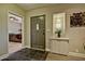 Inviting foyer with stylish tile flooring, a modern cabinet, and a decorative plant display at 701 W Cambridge Ave, Phoenix, AZ 85007