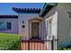 Inviting front door entrance with wrought iron gate and classic, red tile accents at 701 W Cambridge Ave, Phoenix, AZ 85007