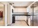 A modern kitchen featuring white cabinetry, stainless steel appliances, and ample counter space at 701 W Cambridge Ave, Phoenix, AZ 85007