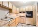 Bright kitchen featuring wooden cabinets, modern appliances, and stylish countertops at 701 W Cambridge Ave, Phoenix, AZ 85007