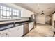 Bright kitchen with a large window and stainless steel appliances at 701 W Cambridge Ave, Phoenix, AZ 85007