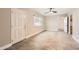 Bright living room featuring tile floors, a front door, and a ceiling fan at 701 W Cambridge Ave, Phoenix, AZ 85007