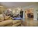 Spacious living room featuring a stone fireplace, hardwood floors, and ample natural light at 701 W Cambridge Ave, Phoenix, AZ 85007