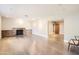 A spacious living room featuring hardwood floors and a stone fireplace, perfect for gathering and relaxation at 701 W Cambridge Ave, Phoenix, AZ 85007