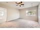 Bright living room with a ceiling fan and large windows at 701 W Cambridge Ave, Phoenix, AZ 85007