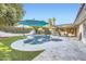 Beautiful pool and spa with a lushly landscaped backyard at 701 W Cambridge Ave, Phoenix, AZ 85007