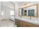 Modern bathroom with double vanity, gold fixtures, and a walk-in shower at 7027 N Scottsdale Rd # 225, Paradise Valley, AZ 85253