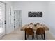 Dining area with wooden table and leather chairs at 7027 N Scottsdale Rd # 225, Paradise Valley, AZ 85253