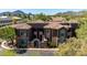 Exterior view of the condo building, showing Spanish style architecture at 7027 N Scottsdale Rd # 225, Paradise Valley, AZ 85253