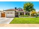 Cute single-story home with a well-manicured lawn and gated driveway at 7837 N 13Th St, Phoenix, AZ 85020