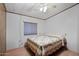 Bedroom with double bed, wood floors, and window with blinds at 8103 E Southern Ave # 39, Mesa, AZ 85209