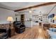 Bright dining area with wood floors and built-in shelving at 8103 E Southern Ave # 39, Mesa, AZ 85209