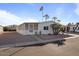 Mobile home with screened porch and desert landscaping at 8103 E Southern Ave # 39, Mesa, AZ 85209