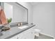 Bathroom with gray countertop, white cabinets, and toilet at 8513 N 172Nd Ln, Waddell, AZ 85355