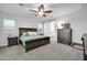 Main bedroom with ensuite bathroom and large dresser at 8513 N 172Nd Ln, Waddell, AZ 85355