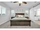 Main bedroom with ensuite bathroom and wood furniture at 8513 N 172Nd Ln, Waddell, AZ 85355