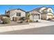 House exterior showcasing landscaping and gray garage door at 8513 N 172Nd Ln, Waddell, AZ 85355