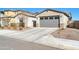 View of house exterior with gray garage door and landscaping at 8513 N 172Nd Ln, Waddell, AZ 85355