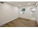 Bright bedroom featuring light wood flooring and a view of the bathroom at 8614 E Appaloosa Trl, Scottsdale, AZ 85258