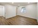 Well-lit bedroom with wood-look floors and access to hall bath at 8614 E Appaloosa Trl, Scottsdale, AZ 85258