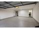 Bright and spacious garage with epoxy flooring, laundry area, and ample storage at 8614 E Appaloosa Trl, Scottsdale, AZ 85258