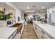 Open kitchen with copper sink, white cabinets, and a view into the dining area at 8614 E Appaloosa Trl, Scottsdale, AZ 85258