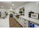 Modern kitchen boasts white cabinets, a copper farm sink, and high-end finishes at 8614 E Appaloosa Trl, Scottsdale, AZ 85258